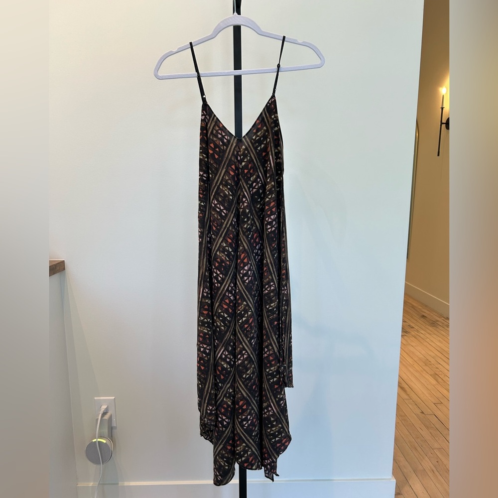 Stand out this summer is this Geometric Hankerchief Midi Dress